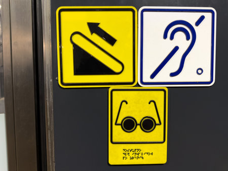 Escalator symbol with directions for people with disabilities. Crossed out ear symbol indicates...