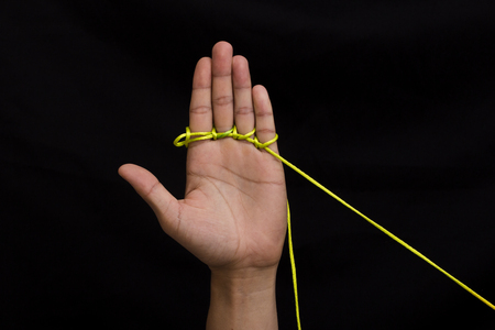 Hand and ropeの写真素材