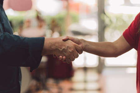 Man and woman shaking hands