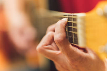 Person playing a classical guitar
