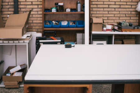Table with a tape measure on it in a workshopの写真素材