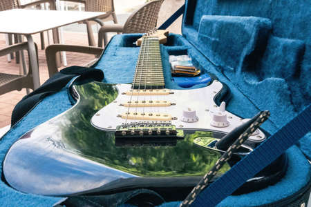 Close up view of an electric guitar in its boxの写真素材