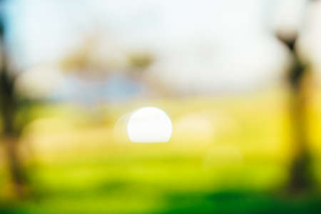 background of the glare of a car crossing the field