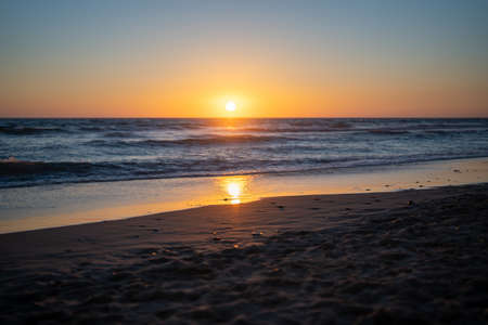 sunset over the sea on the coast of Spainの写真素材