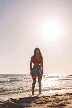 woman splashing in the sea waterの写真素材