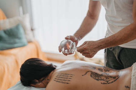 therapist warming up inside a suction cupの写真素材