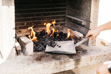 unrecognizable caucasian man preparing the barbecue
