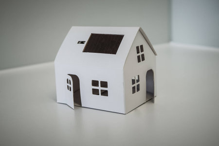 White Paper House with Solar Panel and Switchの写真素材