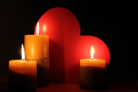 Candles illuminating a love heartの写真素材