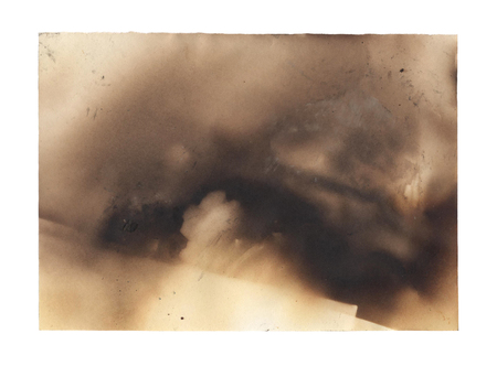 burnt paper isolated on a white backgroundの写真素材