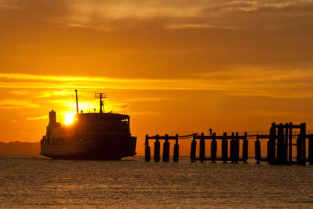 ferry boat to samui during sunsetの写真素材