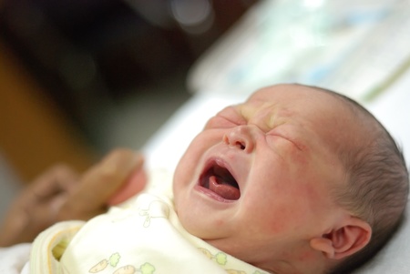 new born infant firt few days different positionsの写真素材