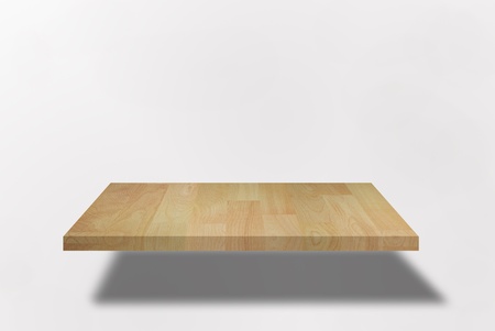 single blank shelf on bright wallの写真素材