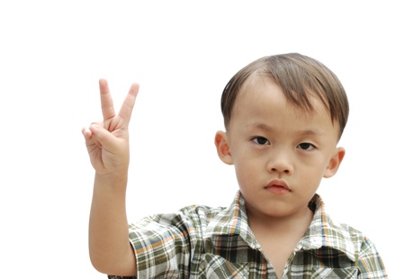 cute young asian boy isolated on white backgroundの写真素材