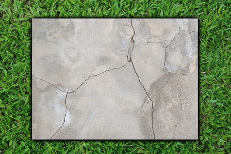 square cincrete surround by grass field for background use.の写真素材