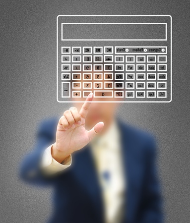 The symbol of financial work by model with modern calculator.の写真素材