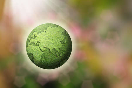 green grass globe on out of focus background.の写真素材