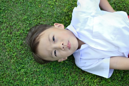 cute asian boy in white shirt in action.