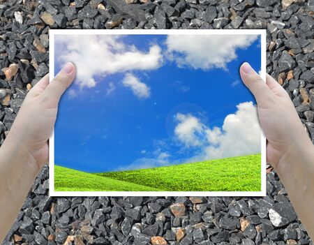 artwork of two hands holding picture frame.の写真素材