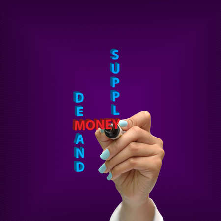 Business selection concept by black pen in hand on purple gradient background.