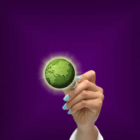 Business selection concept by black pen in hand on purple gradient background.