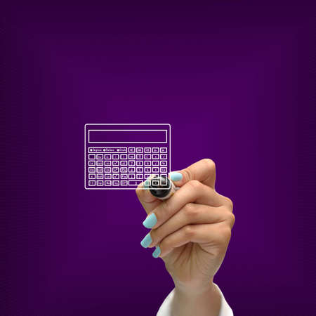 Business selection concept by black pen in hand on purple gradient background.