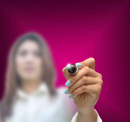 business selection concept by business woman writing business object on gradient purple background.の写真素材