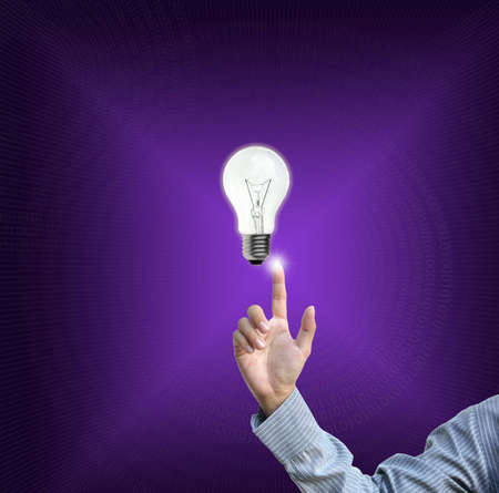 business selection concept by businessman pointing business object on gradient purple background.の写真素材
