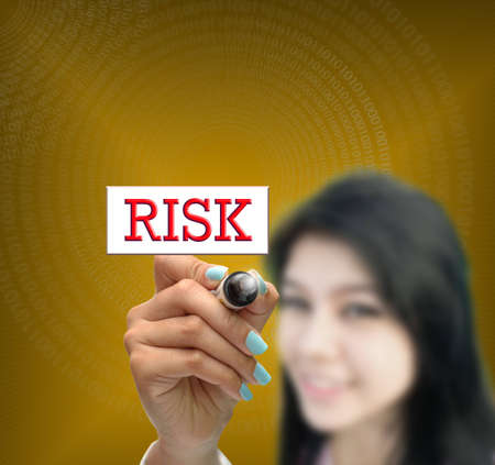 business selection concept by business woman writing business object on gradient yellow background.の写真素材