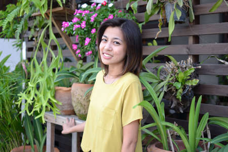 Cute young asian woman portrait outdoor scene.