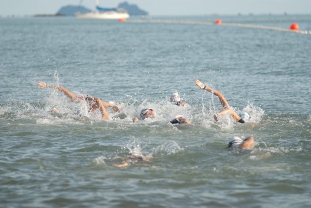 SAMUI, THAILAND - APRIL 22 2012: Samui triathlon 2012 event. Competitors in swimming action during the triathlon on Sunday 22 April 2012 in Ko Samui island, Suratthani, Thailand.のeditorial素材