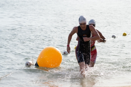 SAMUI, THAILAND - APRIL 22 2012: Samui triathlon 2012 event. Competitors in action during the triathlon on Sunday 22 April 2012 in Ko Samui island, Suratthani, Thailand.のeditorial素材