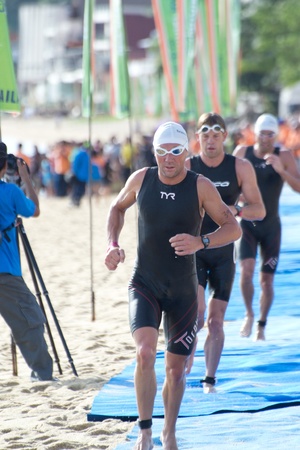 SAMUI, THAILAND - APRIL 22 2012: Samui triathlon 2012 event. Competitors in action during the triathlon on Sunday 22 April 2012 in Ko Samui island, Suratthani, Thailand.のeditorial素材