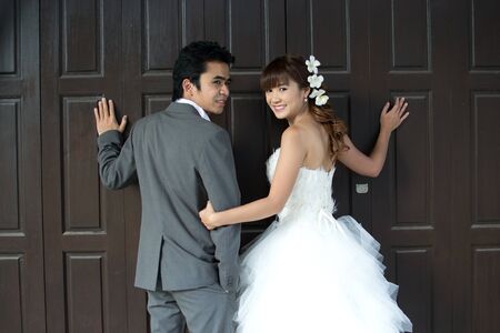 Asian couple with pre wedding scene out door background.の写真素材
