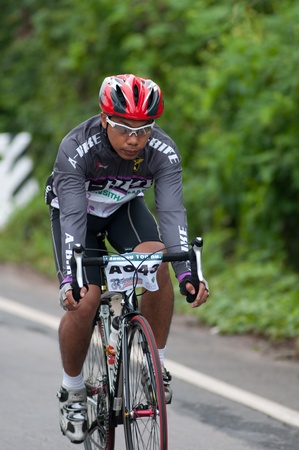 SURATTHANI, THAILAND - JULY 8: Unknown riders in action during Suratthani bike race 2012 at Suratthani on July 8, 2012 in Suratthani, Thailand.のeditorial素材
