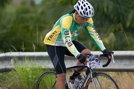 SURATTHANI, THAILAND - JULY 8: Unknown riders in action during "Suratthani bike race 2012" at Suratthani on July 8, 2012 in Suratthani, Thailand.のeditorial素材