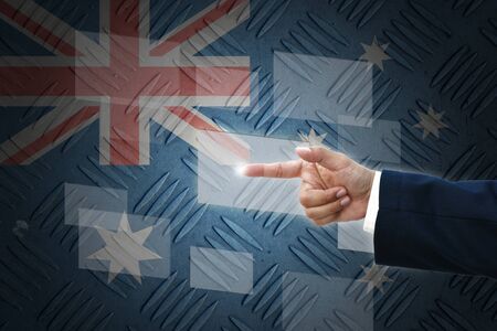 business hand selecting business icon on old Australia flag background.の写真素材