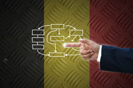 business hand selecting business icon on old Germany  flag background.の写真素材