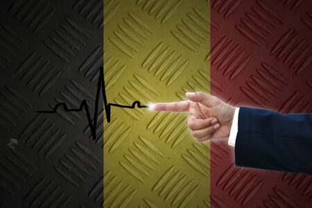 business hand selecting business icon on old Germany  flag background.の写真素材