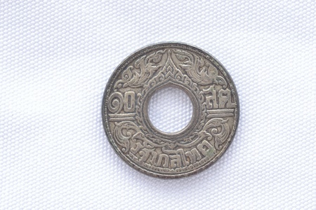 close-up of rare thai old coin on white pattern background.の写真素材