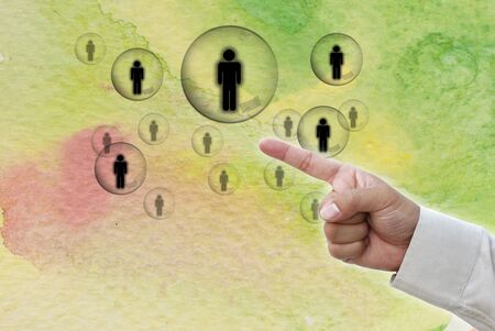 Hand pointing at business object on water color water art background.の写真素材