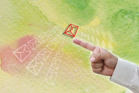 Hand pointing at business object on water color water art background.の写真素材