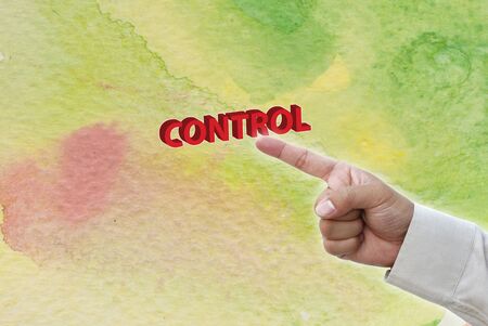 Hand pointing at business object on water color water art background.の写真素材