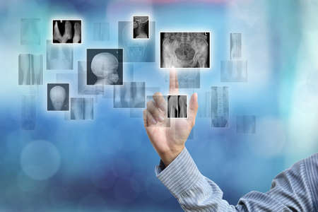 business hand selecting business icon on blue abstract background.の写真素材