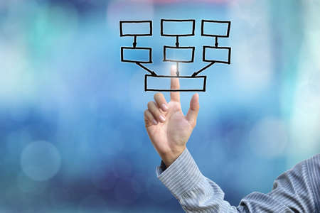 business hand selecting business icon on blue abstract background.の写真素材