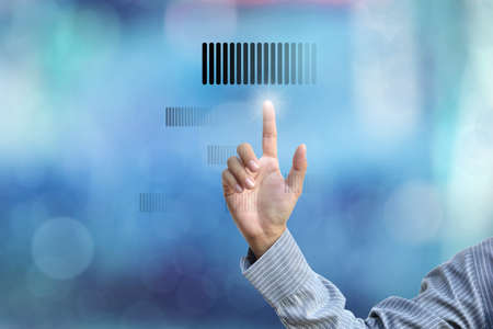 business hand selecting business icon on blue abstract background.の写真素材