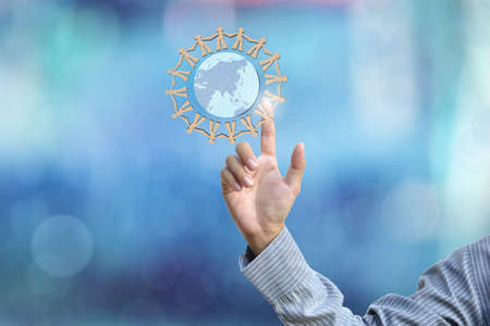 business hand selecting business icon on blue abstract background.の写真素材