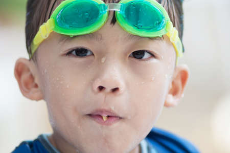 Cute asian boy with swim suit.の写真素材
