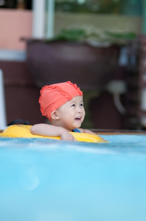 Cute small asian kid with swim suit.の写真素材