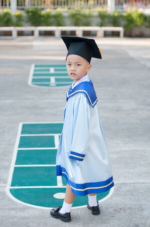 Asian boy in kindergarten graduate ceremony.の写真素材